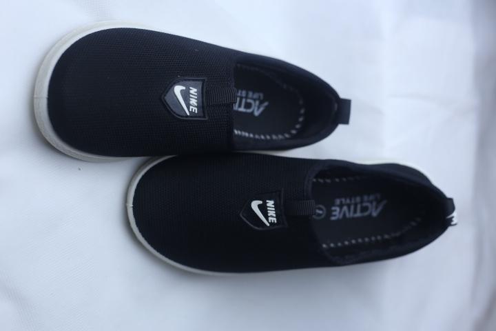 Sleek Black Slip On Sneakers for Women in Pakistan: Breathable Rexine Shoes with White Rubber Sole for School & Office